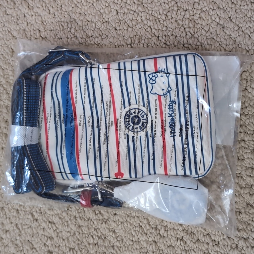 Brand new with tag Hello Kitty x Kipling Classic Stripes Tally Sling Bag